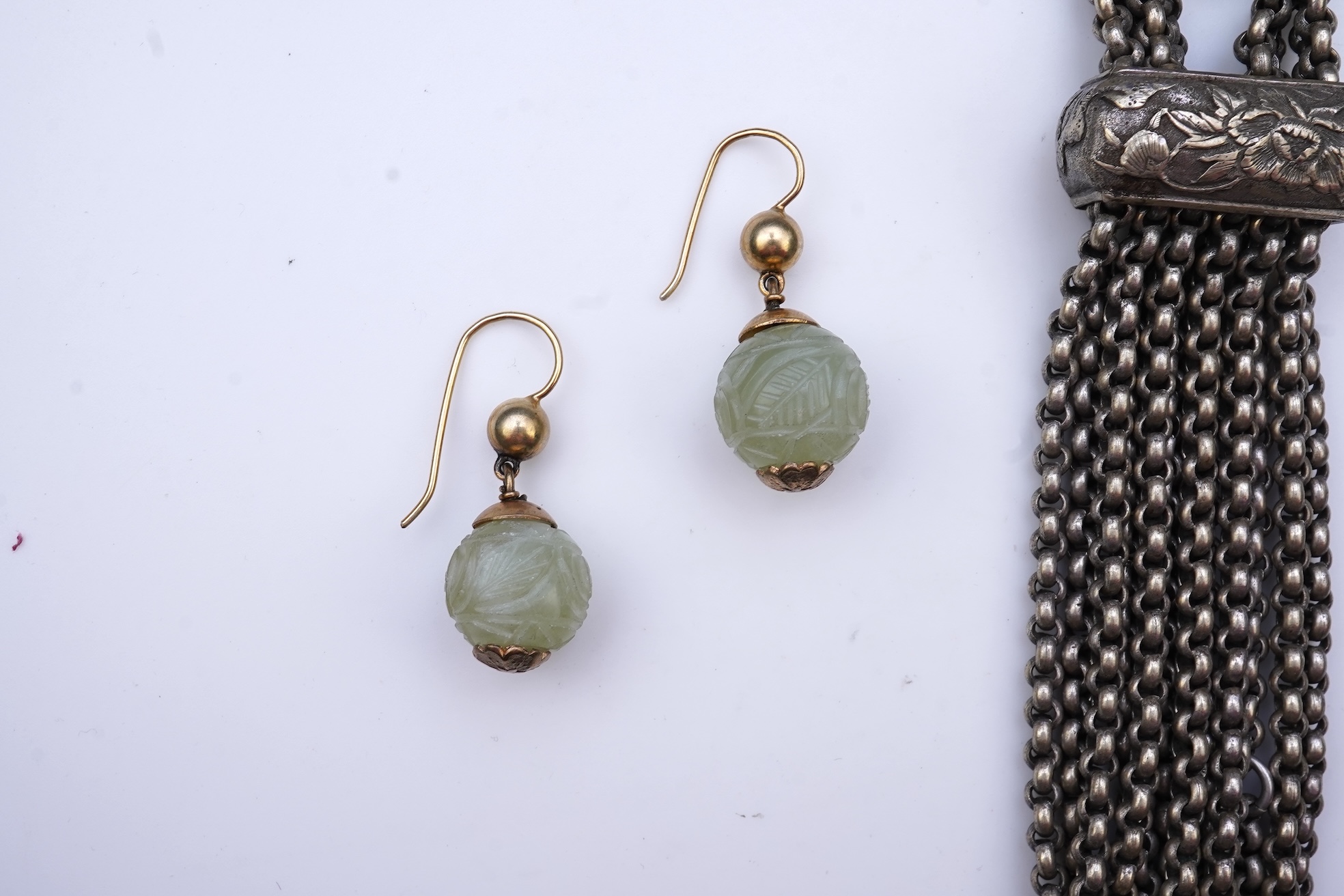 A chatelaine and a pair of serpentine bead earrings